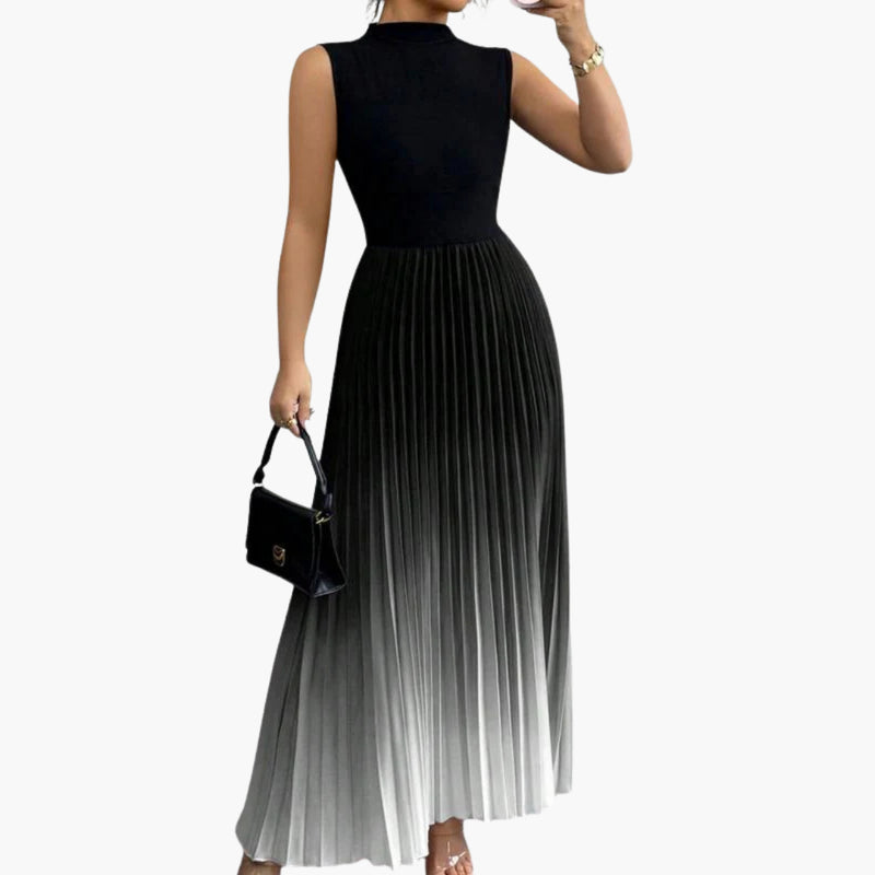 Model wearing ombre pleated maxi dress, full-length side profile showing movement