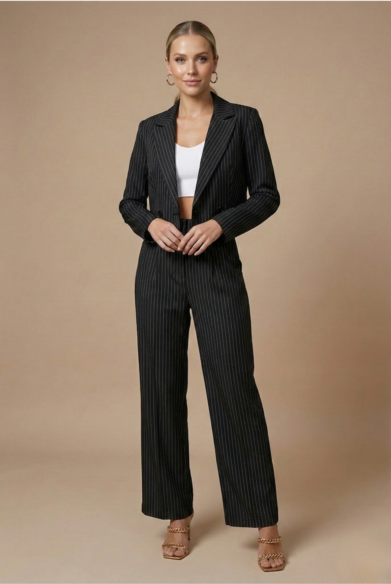 Women's pinstripe blazer trouser set displayed flat on white background