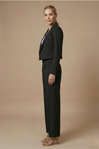 Model wearing pinstripe blazer and wide leg trousers, front view