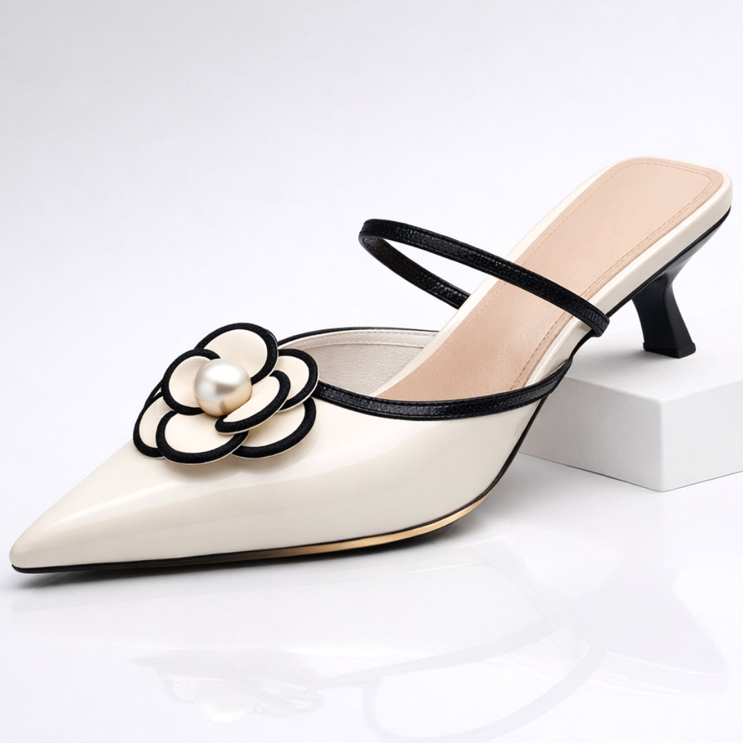 Woman wearing black pearl flower mule, standing pose showing full silhouette