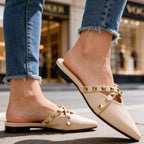 Three-quarter angle of studded mule with stud embellishment visible