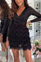Black sequin mini dress with V-neckline and fringe skirt, front view