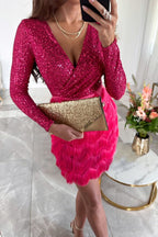 Model wearing black sequin dress, side pose showing fringe movement