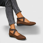 Close-up detail of elasticated cross strap and cushioned insole