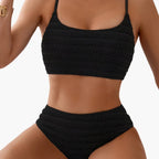Women's textured high-waisted bikini set with scoop neck top displayed flat