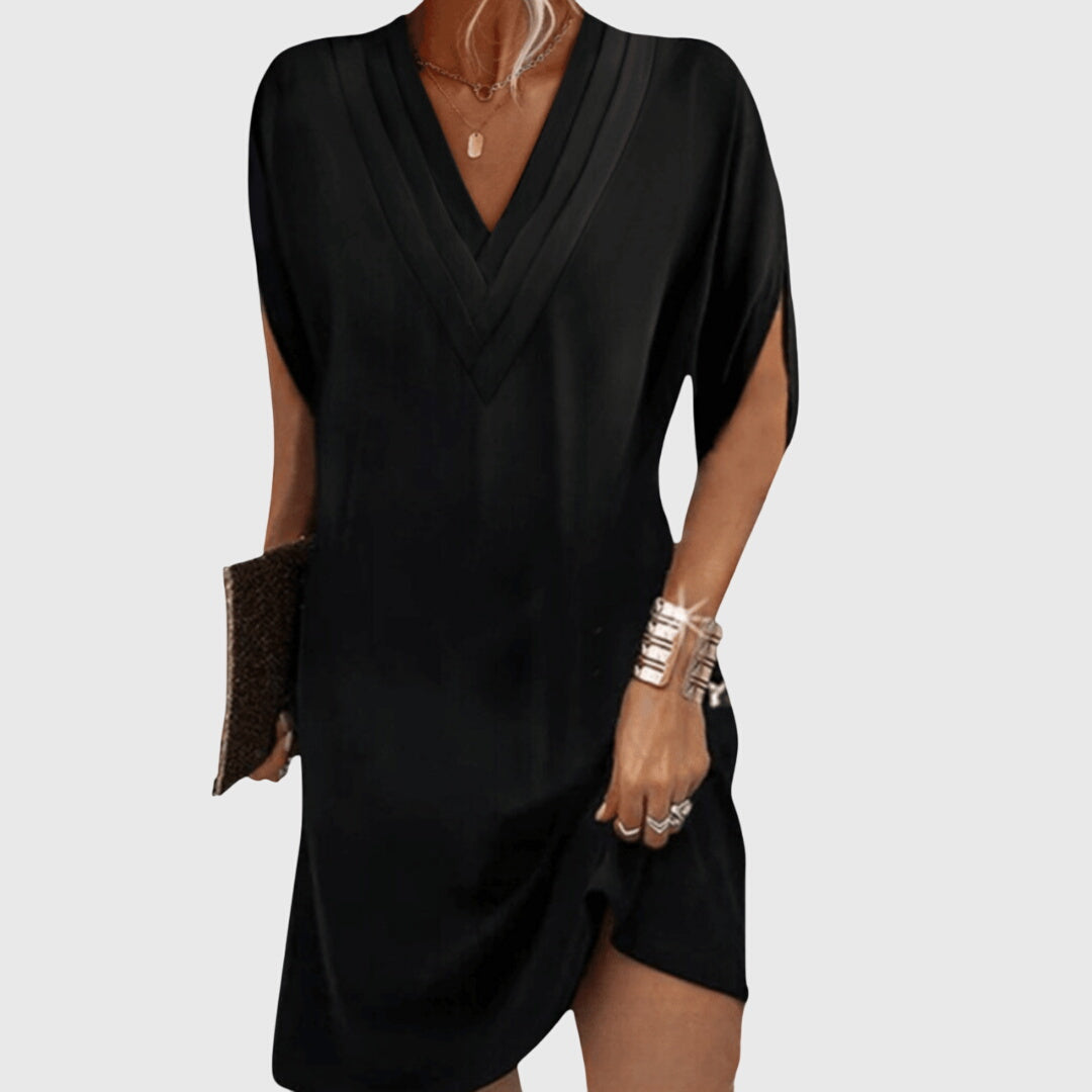 Black mini dress with V-neckline and batwing sleeves, front view