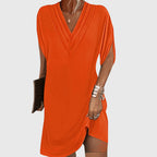 Model in black mini dress, full-length pose showing movement