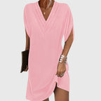 Detail of wrap V-neckline and batwing sleeve construction
