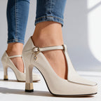 Walking pose in T-strap court shoes, side view
