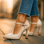 Top-down view of pointed toe and T-strap across foot