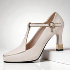 Side profile of court shoe showing pointed toe and block heel