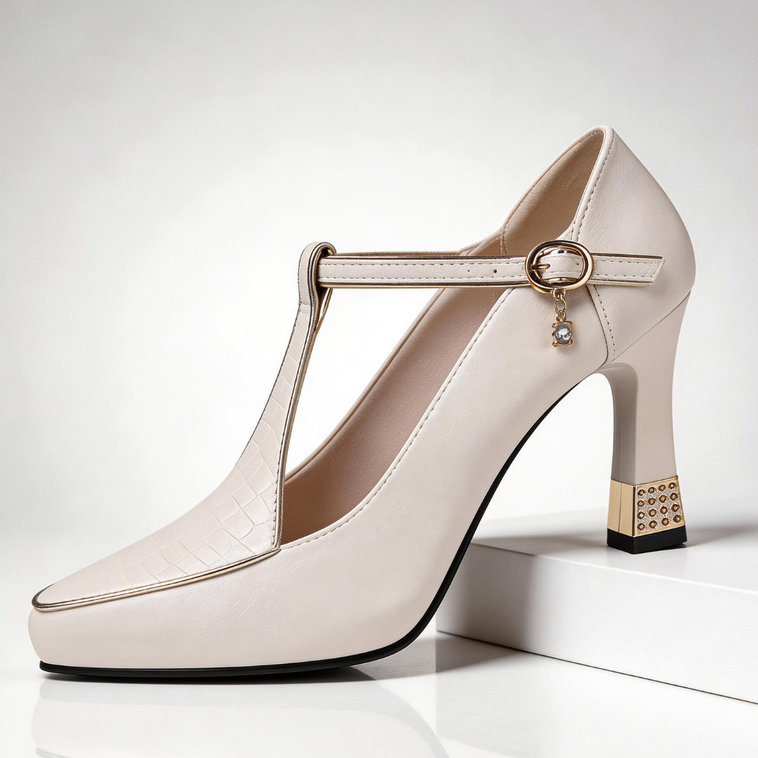 Side profile of court shoe showing pointed toe and block heel