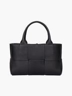 Women's woven leather tote bag with structured silhouette, front view