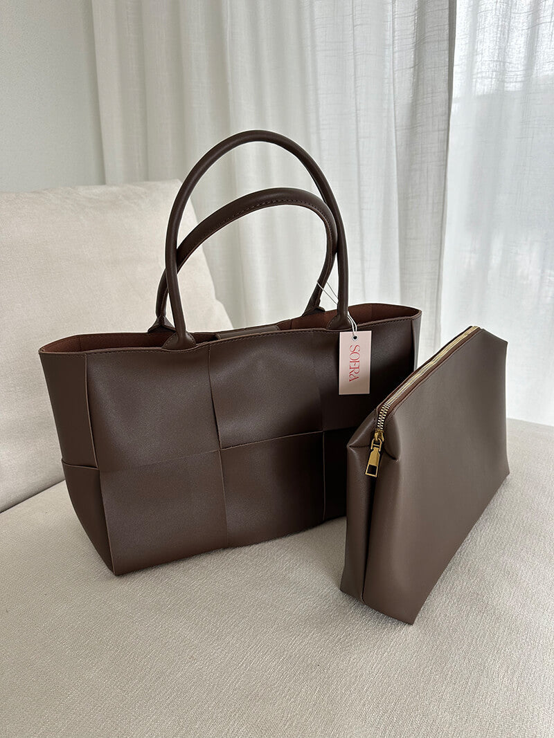 Woven tote bag shown from side angle, displaying depth and shape