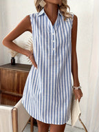 Model wearing blue and white striped mini dress, front view showing button placket and collar detail