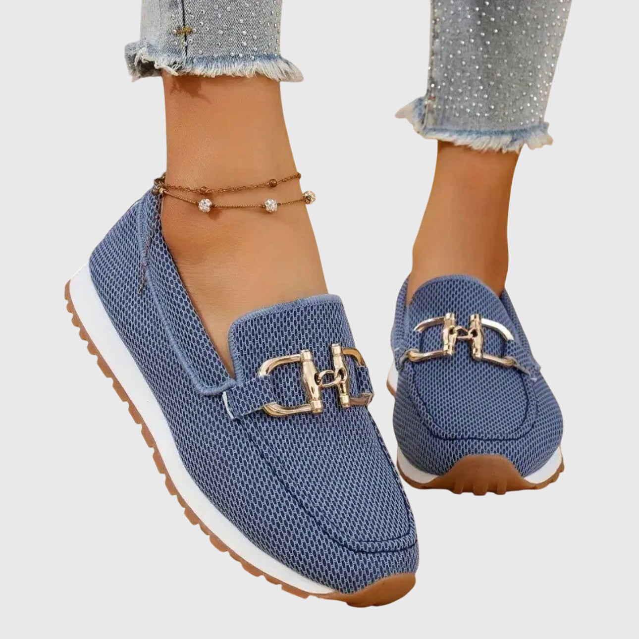 Women's denim slip-on loafers with gold horsebit hardware, front view