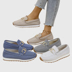 Flat lay of denim loafer with styling accessories nearby