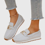Rear view of denim loafer showing heel construction
