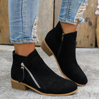 Side profile showing block heel and side zip closure