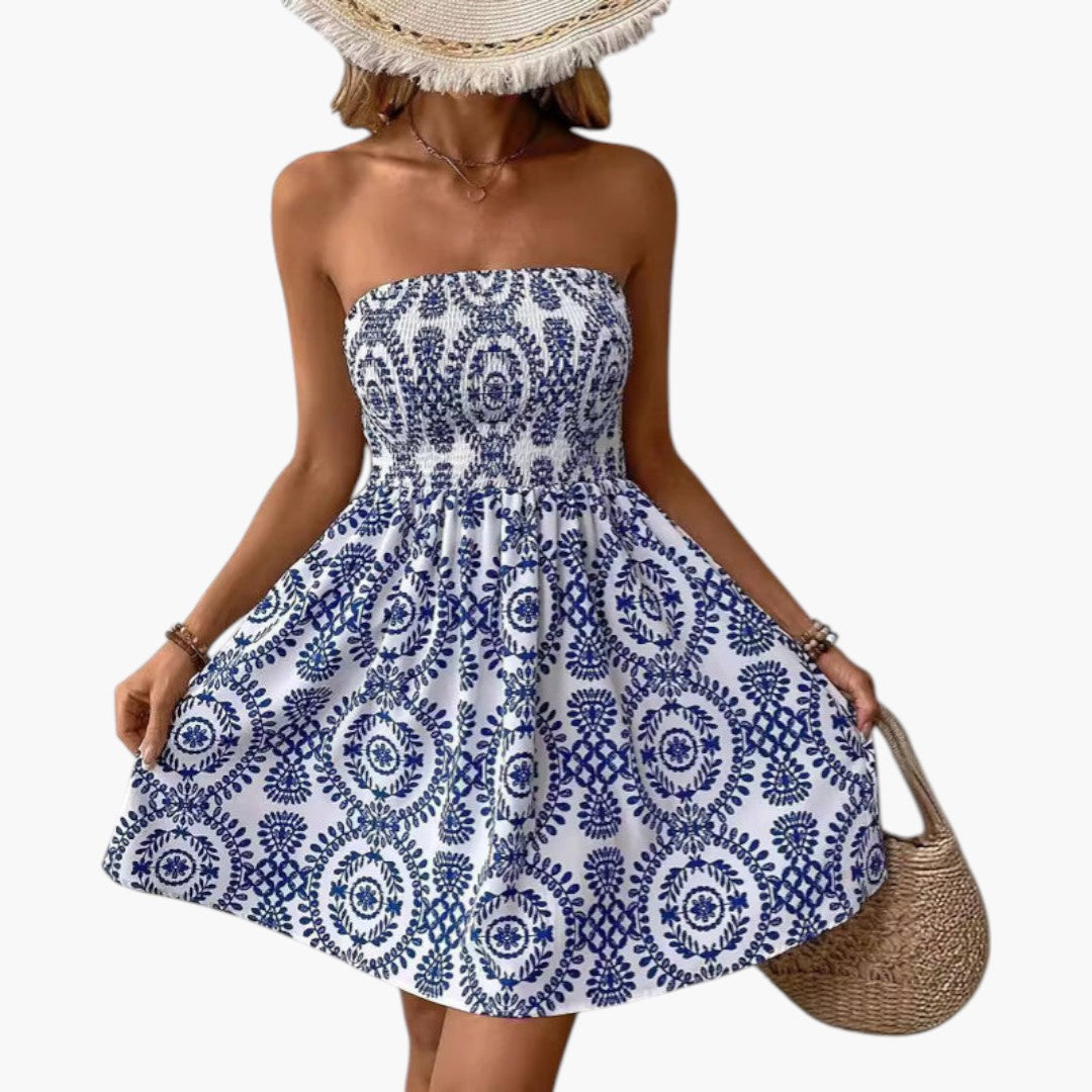 Women's blue floral bandeau mini dress displayed on dress form, front view