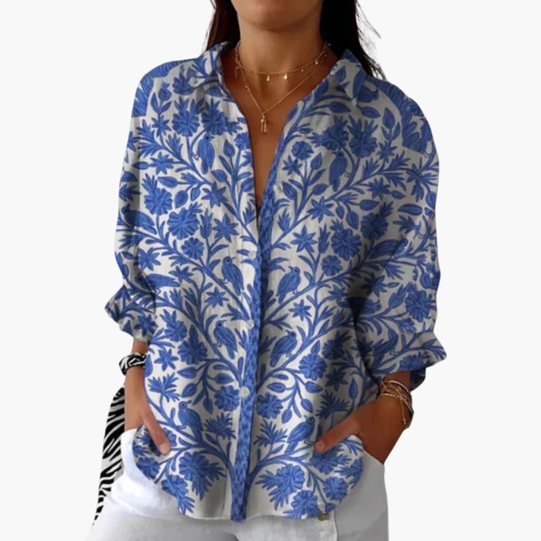 Women wearing blue floral long sleeve cotton blouse, front view