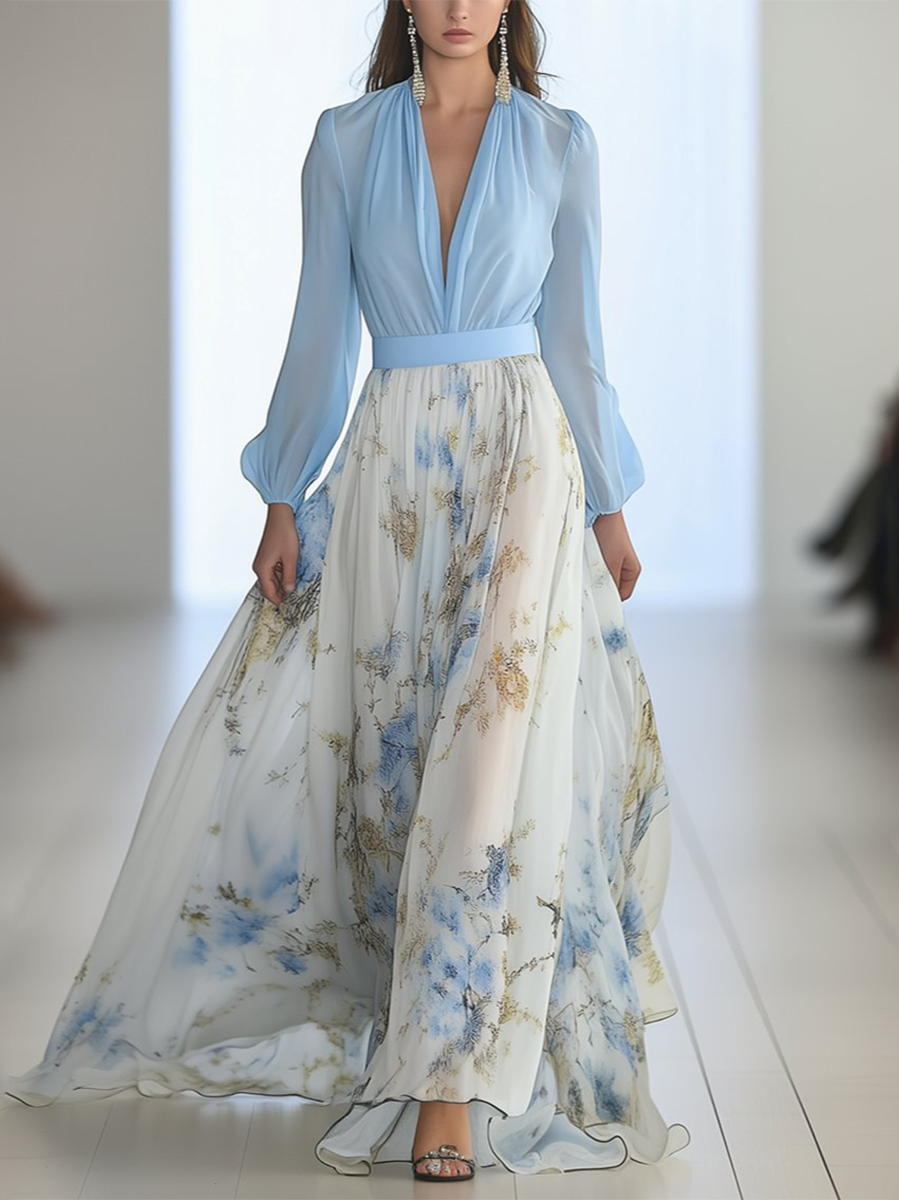 Women's blue and ivory floral maxi dress with V-neckline and long sheer sleeves, full length view