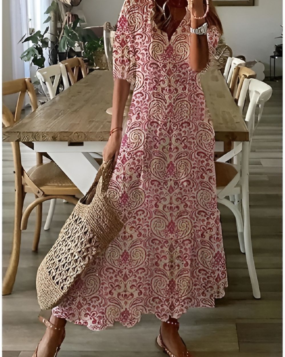 Model in ikat maxi dress, side angle walking pose