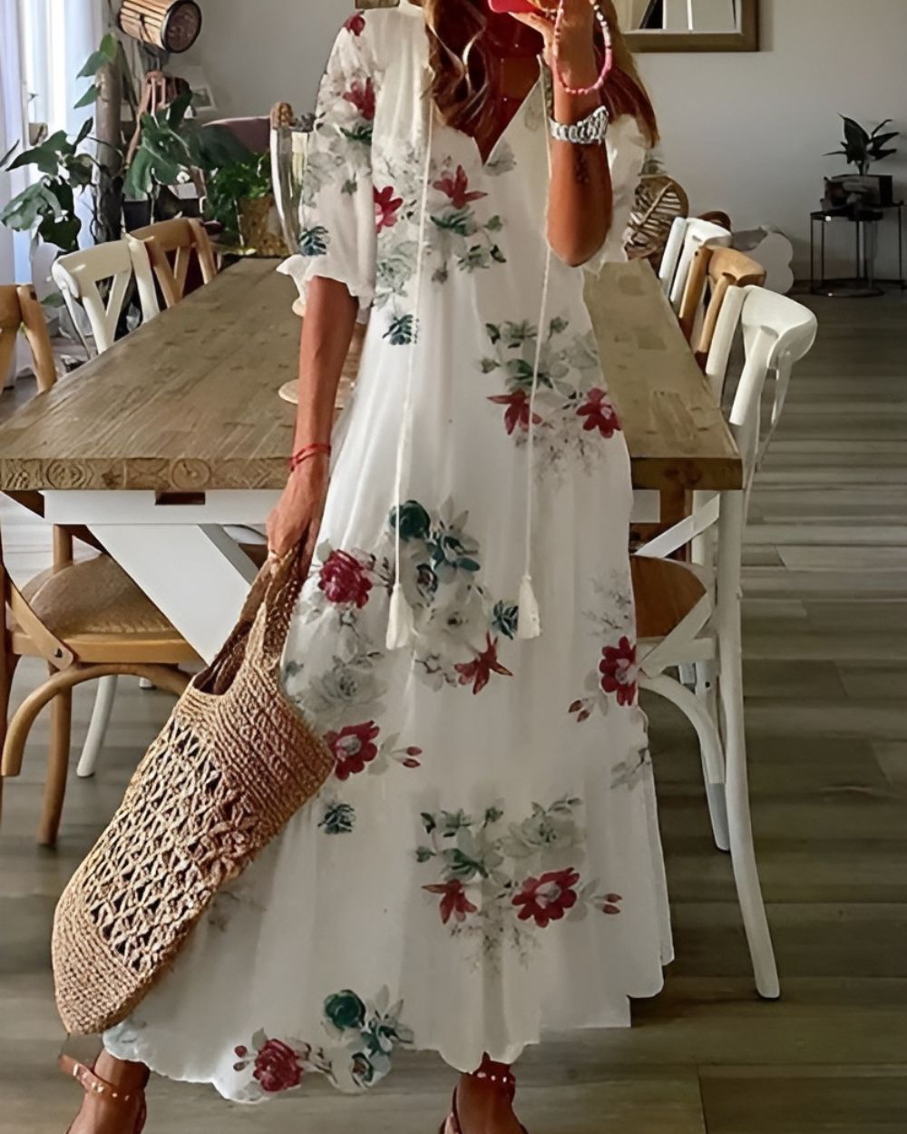 Overhead flat lay of folded ikat tassel tie maxi dress