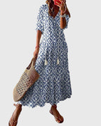 Women's blue and white ikat maxi dress with v-neckline, displayed flat