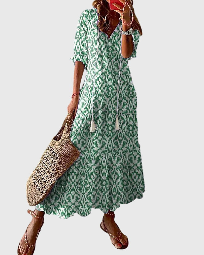 Model in blue and white ikat dress, full-length side profile