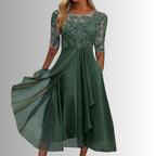 Back view of sheer three-quarter sleeves and midi length skirt