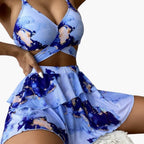 Women's marble print padded bikini set with matching overlay skirt, front view