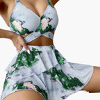 Rear view of marble print bikini bottom and layered overlay skirt