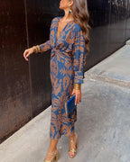 Women's paisley maxi dress with long sleeves and front knot detail, full length view