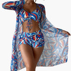 Women's swirl bikini set displayed flat with matching sheer cover-up robe