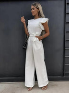 Close-up detail of ruffle cap sleeve on blue jumpsuit