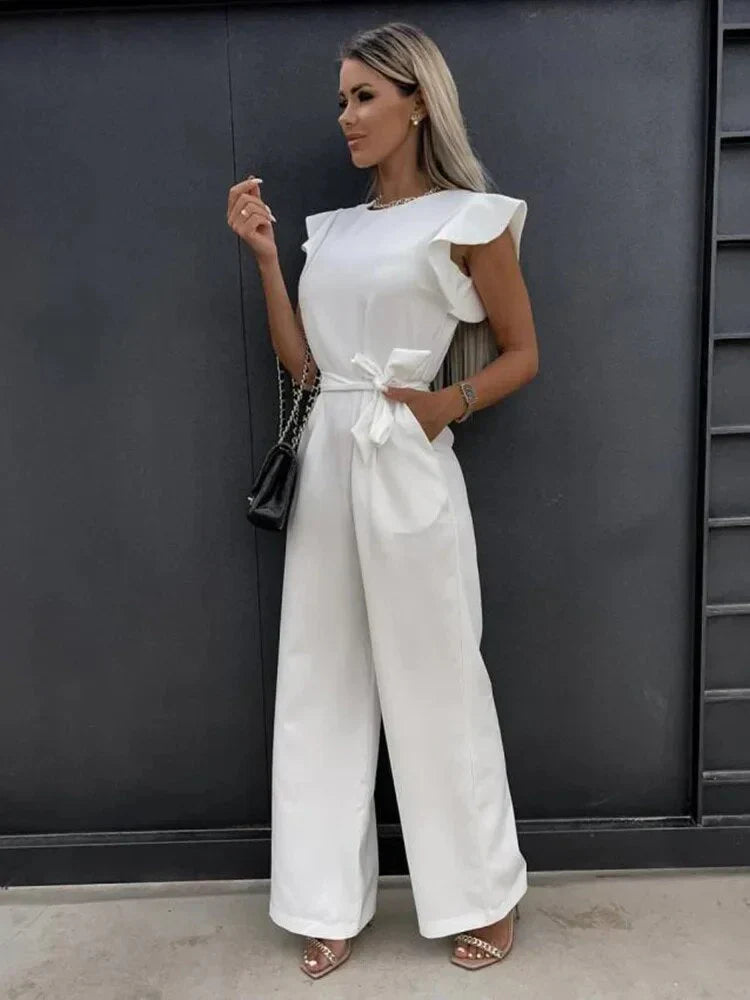 Close-up detail of ruffle cap sleeve on blue jumpsuit