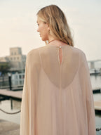Back view of maxi dress with flowing chiffon layers