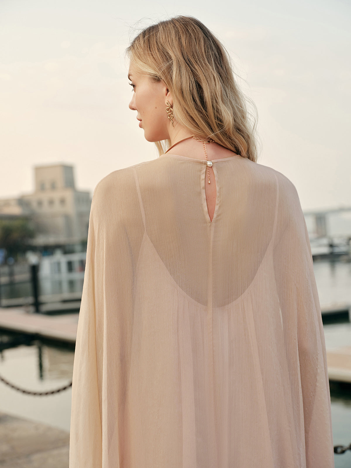 Back view of maxi dress with flowing chiffon layers