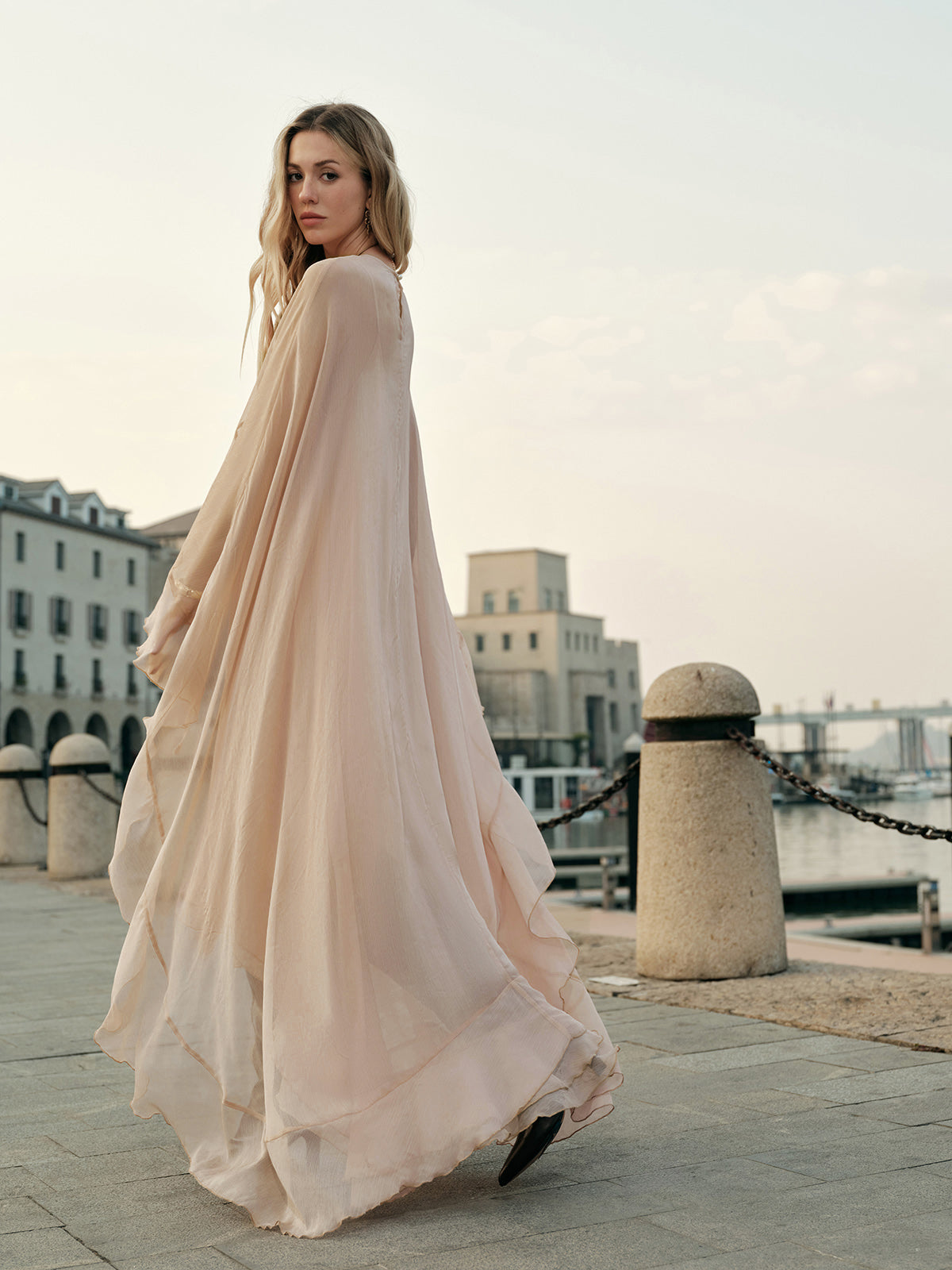 Close-up of cloak sleeve detail and draping