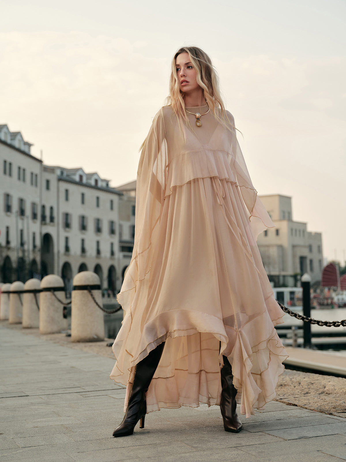 Model wearing dress in standing pose showing full silhouette
