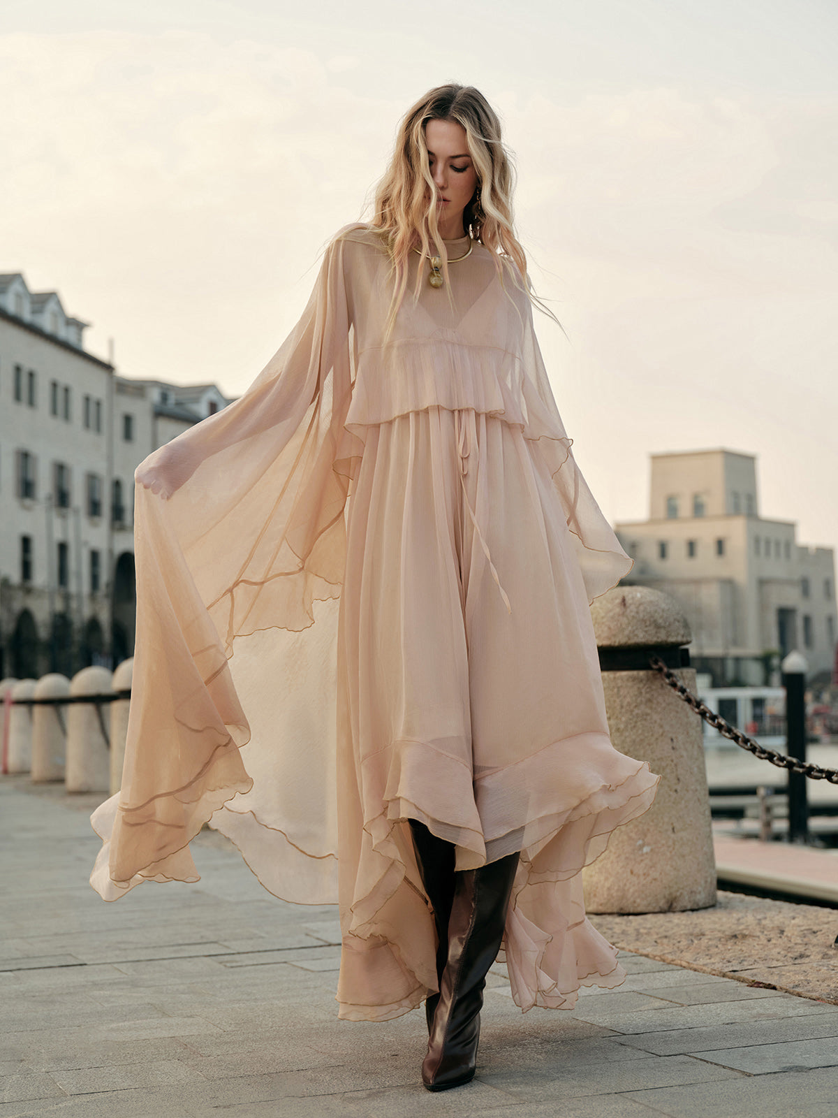 Full-length maxi dress with cloak sleeves and layered chiffon skirt