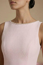 Pearl beading along boat neckline close-up