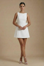Full-length dress worn by model, rear angle view
