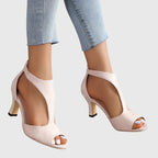 Side profile of peep toe sandal showing block heel and cutout silhouette