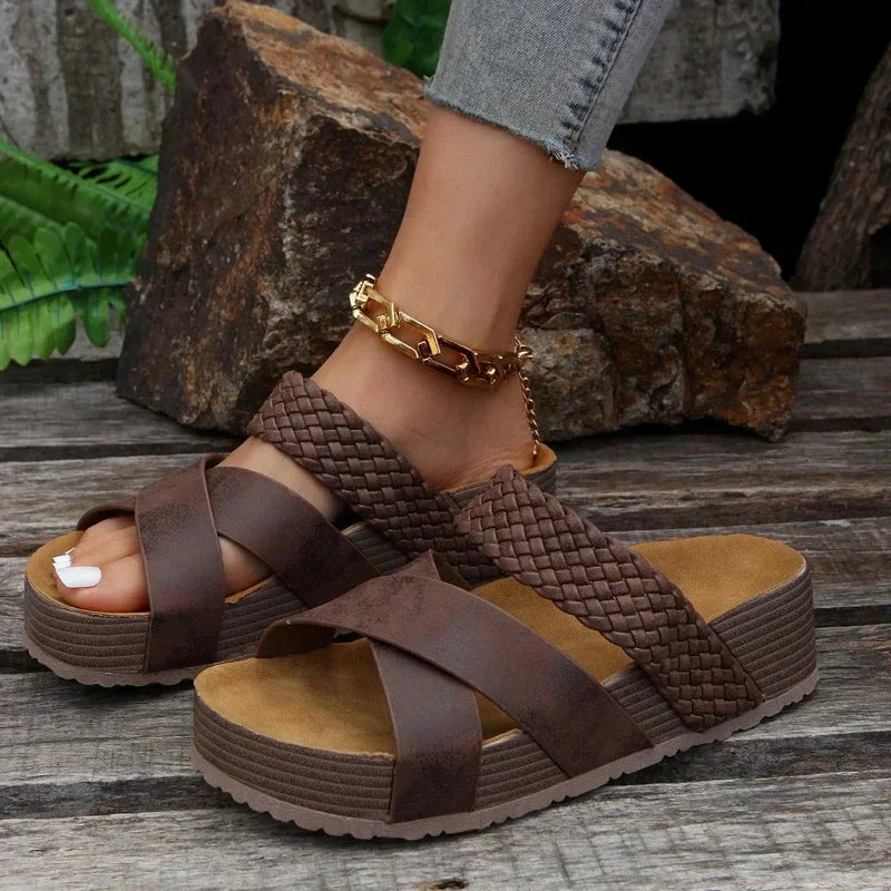 Model wearing braided wedge sandals, side profile pose