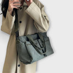 Corduroy tote bag worn crossbody from side angle