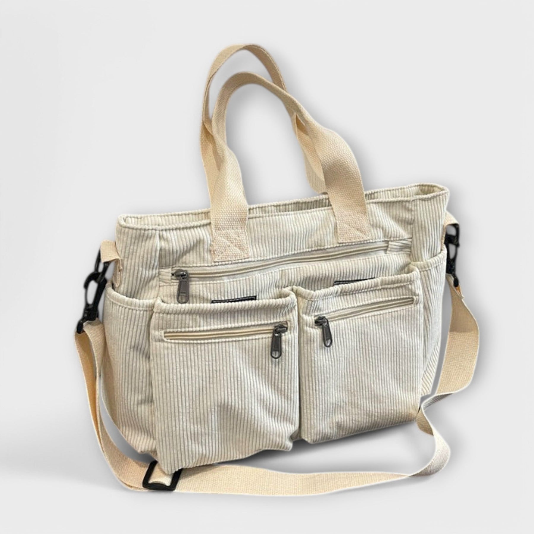 Corduroy tote bag in lifestyle setting with essentials