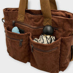 Close-up of zip pocket detail on corduroy tote