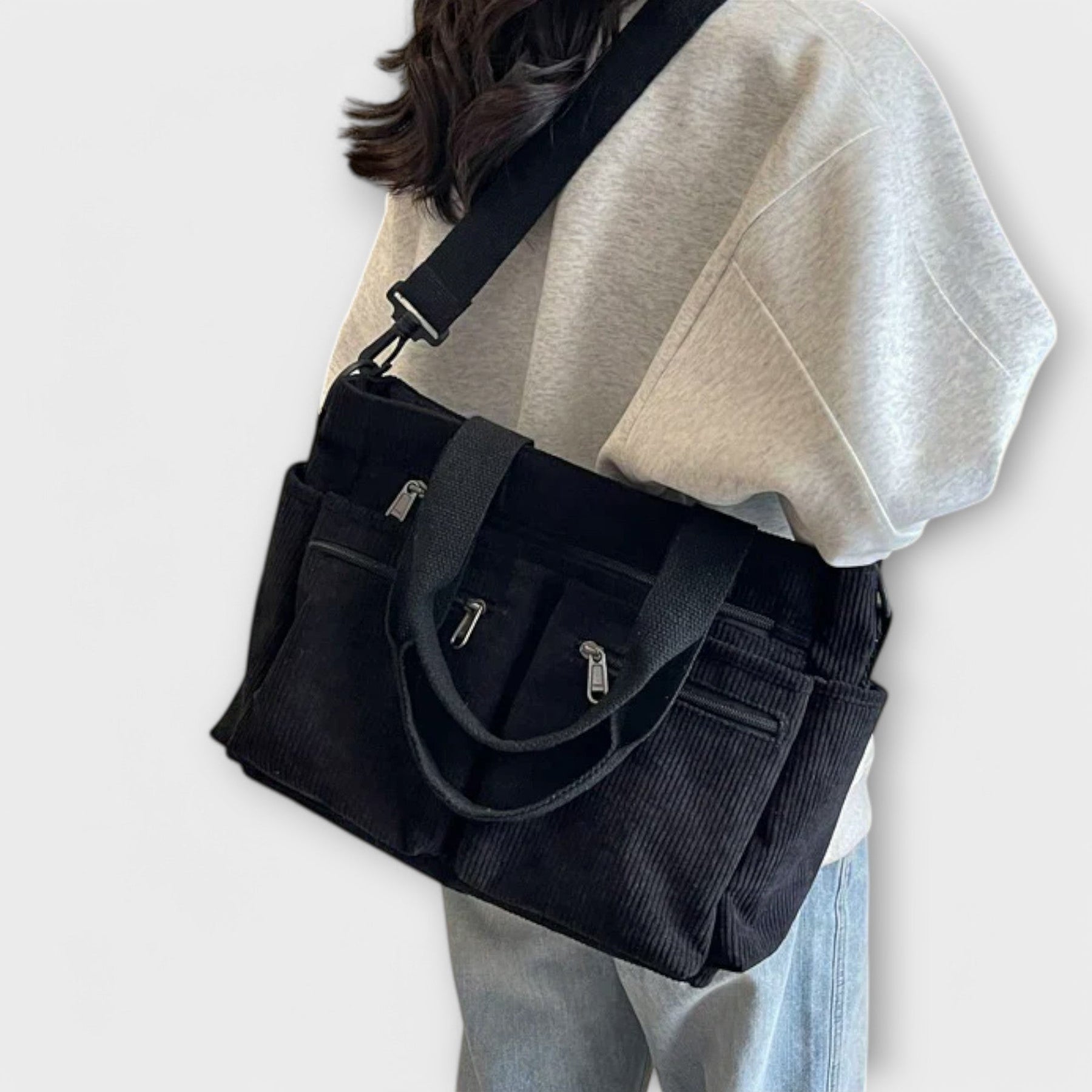 Adjustable crossbody strap detail on tote